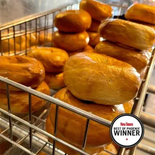 a wire basket full of bagels