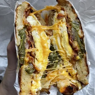 Fried Egg, Bacon, Cheddar, and Onions on Jalapeño Cragel