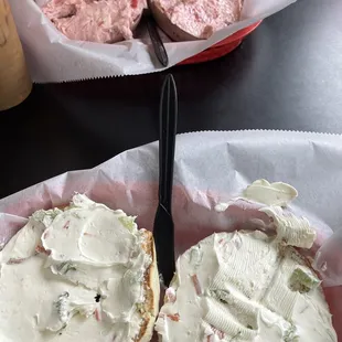 White Rye bagel with Vegetable Spread, Blueberry bagel with strawberry spread