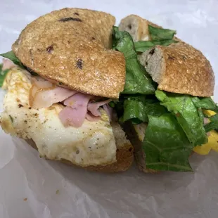NYC Breakfast Sandwich- with ham, lettuce, tomato on a cinnamon raisin bagel