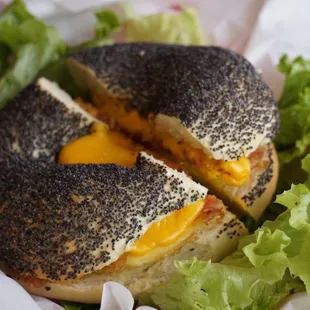 a bagel with cheese and lettuce