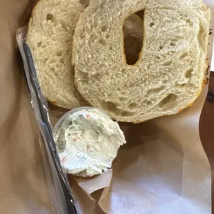 Cheddar bagel with veggie cream cheese on the side