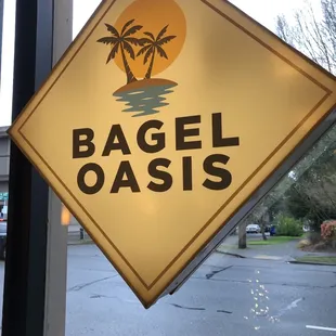 a sign for a bagel oasis