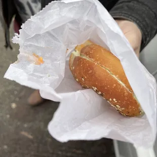 you can see the salmon cream cheese on the inside of my partner&apos;s bagel bag. neither of us ordered salmon.