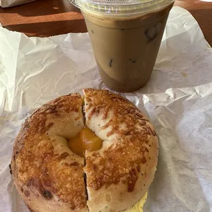 Eggwich with cheddar cheese, Asiago bagel. Vietnamese iced coffee