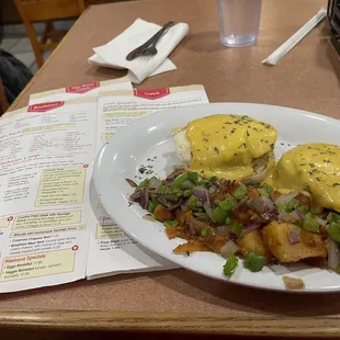 Veggie eggs Benedict with side of potatoes w onions and peppers