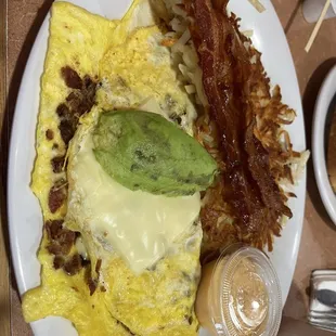 Bacon, avocado and siracha mayo with shreddies ans bacon.