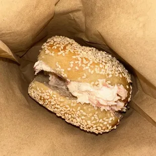 a sandwich in a brown paper bag