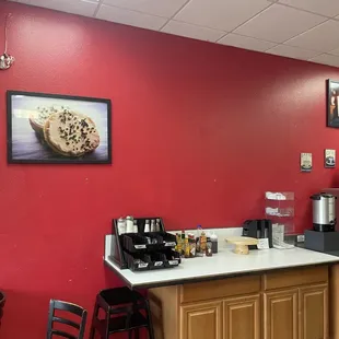 a coffee shop with red walls
