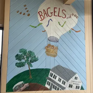 a hot air balloon flying over a house