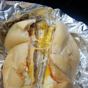 Sausage, egg (over easy), cheese, ketchup, pepper on a scooped and toasted (even though it was barley toasted) "kaiser roll"