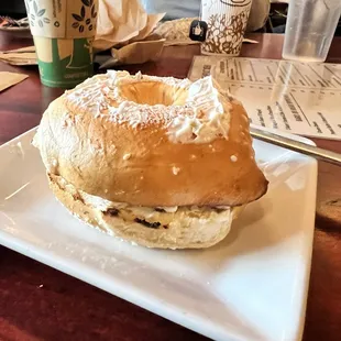 Salt bagel with olive cream cheese