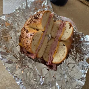 Lunch ham and cheese toasted on an onion bagel