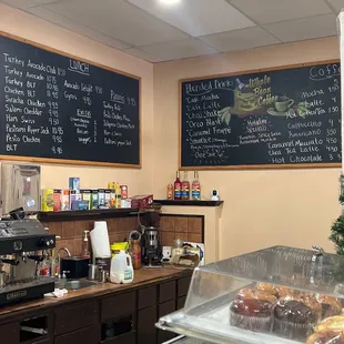 a bakery with a menu on the wall