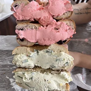 Strawberry cream cheese on blueberry bagel &amp; scallion cream cheese on everything bagel