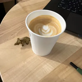 A double cortado and a small dinosaur.