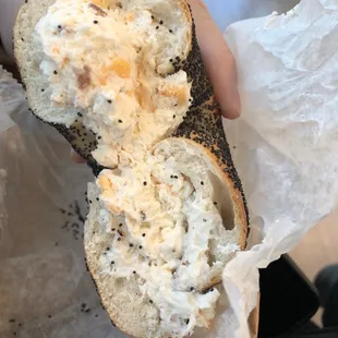 Poppy seed bagel with bacon cheddar cream cheese - Delicious