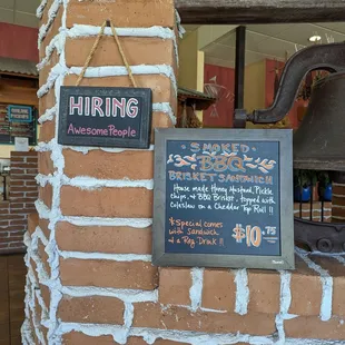 a brick wall with a sign on it