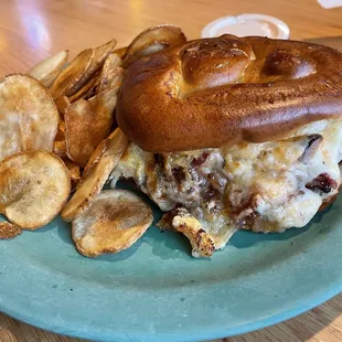 Reuben sandwich on a pretzel bun with Homemade Chips
