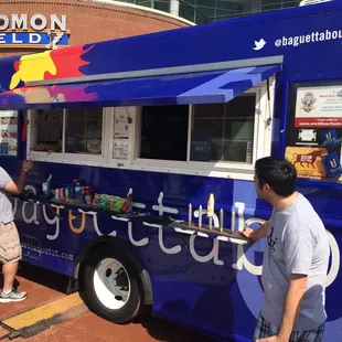 people ordering food from a food truck