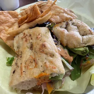 a sandwich and chips on a plate