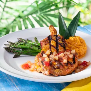 Grilled, topped with pineapple chutney and served with asparagus and cinnamon mashed sweet potatoes because we&apos;re extra like that.