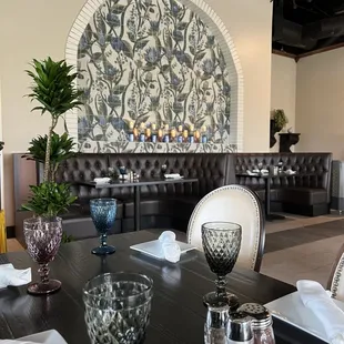 a dining room with a table and chairs