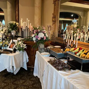 a buffet of fruit and flowers