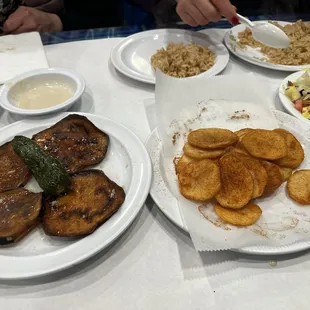 Bahary eggplant and potato chips, salads and rice