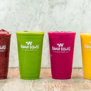 a row of smoothie cups