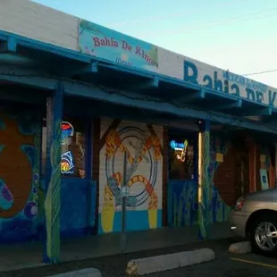 a car parked in front of a restaurant