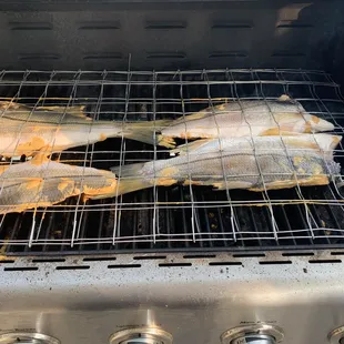 Grilled Robalo fish. Zarandeado.