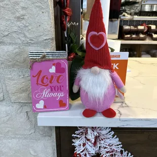 a valentine gnome and a love always sign
