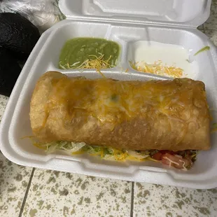 Ground beef chimichanga with liquid guacamole and sour cream