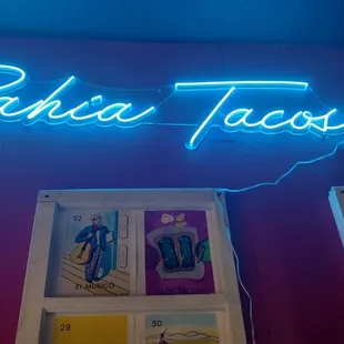 a neon sign on a wall