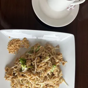 a plate of noodles and a cup of coffee