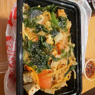 Spicy drunken noodles with tofu-spicy and good. Different since they add tomato and bamboo shoots