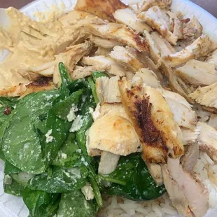 Chicken shawarma plate with rice hummus and spinach salad