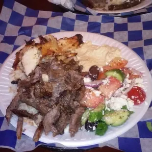 Shwarma style chicken and beef with a side of hummus, greek salad, and grape leaves. None of this is fast food by a long shot.