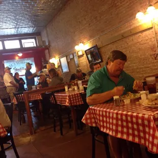 a man sitting at a table eating