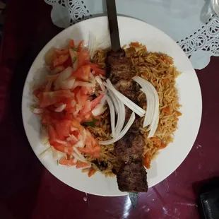 Lamb kebab with brown rice and fresh salad