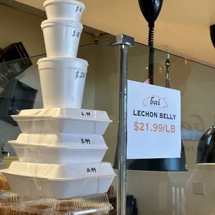 Prices per lb for lechon and per container for other foods.