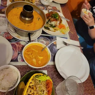Top down: druken noodle, soup, massaman curry, pineapple fried rice; right most is the duck