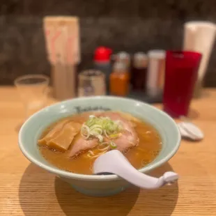 Shoyu ramen topped with chashu pork and bamboo shoots