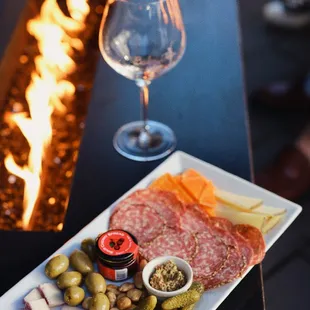 charcutette, cheese, pickles, olives, and pickles on a