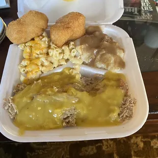 Soul Food yumminess. Chicken and dressing, mashed potatoes and gravy, Mac n cheese and cornbread.