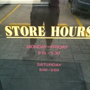 a store hours sign