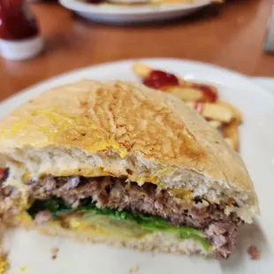 a half eaten sandwich on a plate