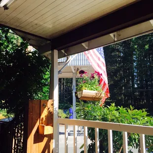 an american flag on a porch