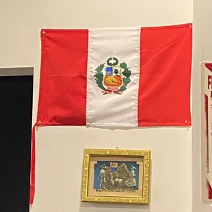a mexican flag hanging on a wall